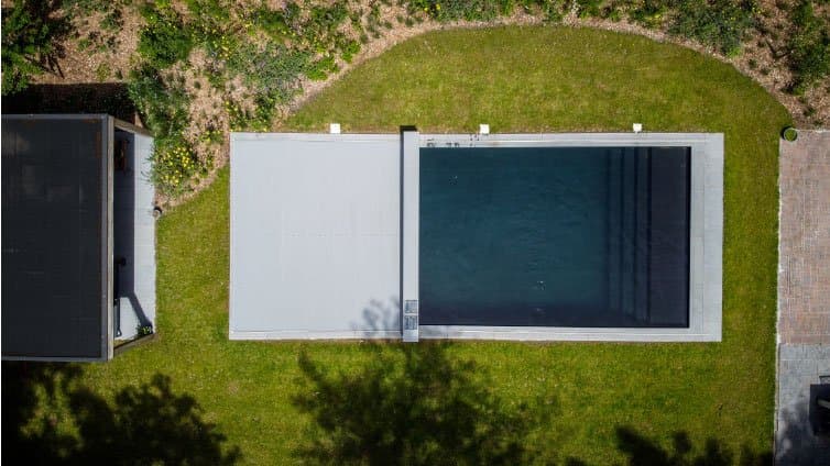 Aerial cover halfway across the pool